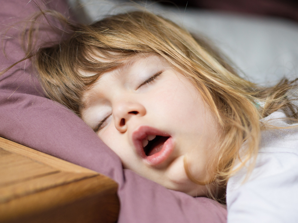 young girl sleeping with her mouth open